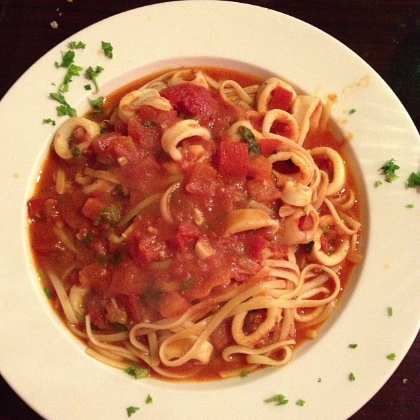 Dan took me to a cute little Italian place called Bella Napoli, and we had a huge dinner. This is mine - fresh calamari in a light tomato sauce, served over linguine. 