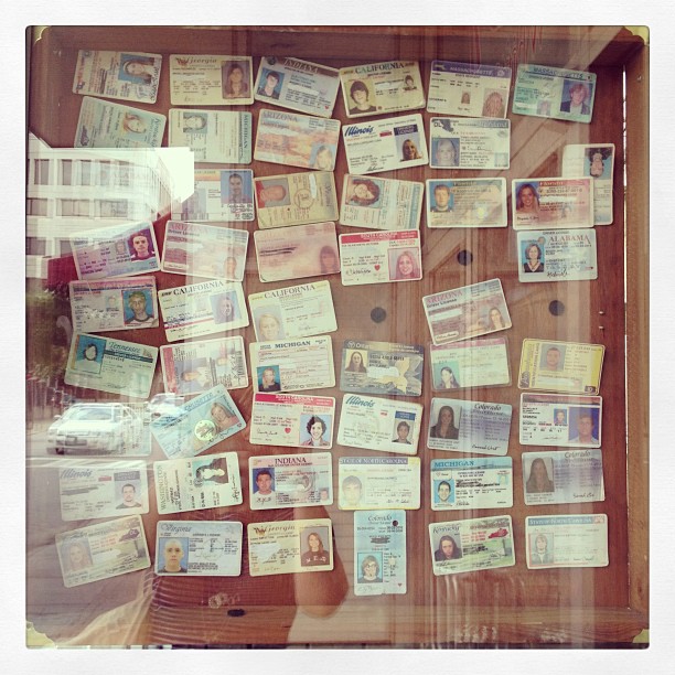 Confiscated fake IDs on the "wall of shame" outside of a Savannah bar.