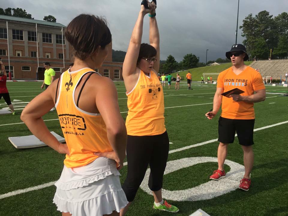 Doing kettlebell swings in Workout #1.