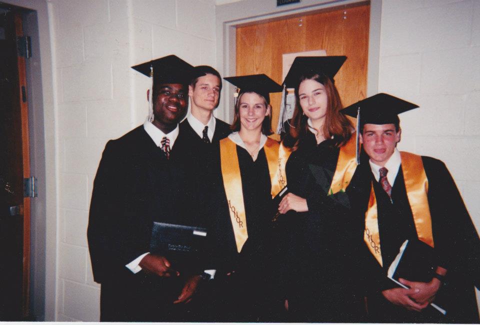 At graduation, making a silly face (as always). I'm the one with long hair, and Aydrian's directly to my left.